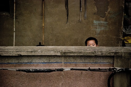 November: Young Boy on Balcony 