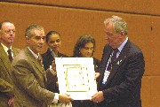 The Secretariat of the Convention presents Unep Executive Director Klaus Toepfer with an award for his years of service.